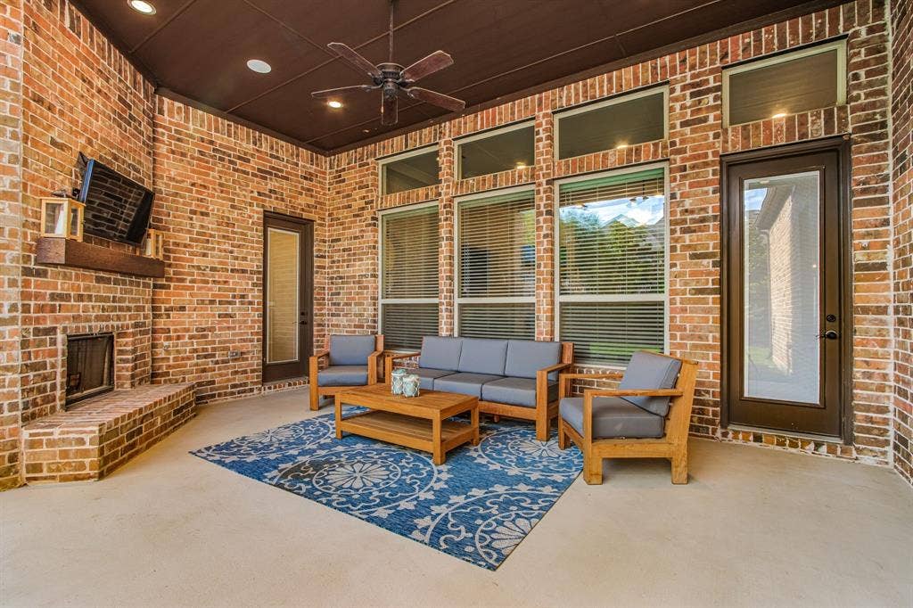 I'm sure everyone will enjoy this Covered Outdoor living space with Gas Fireplace!!