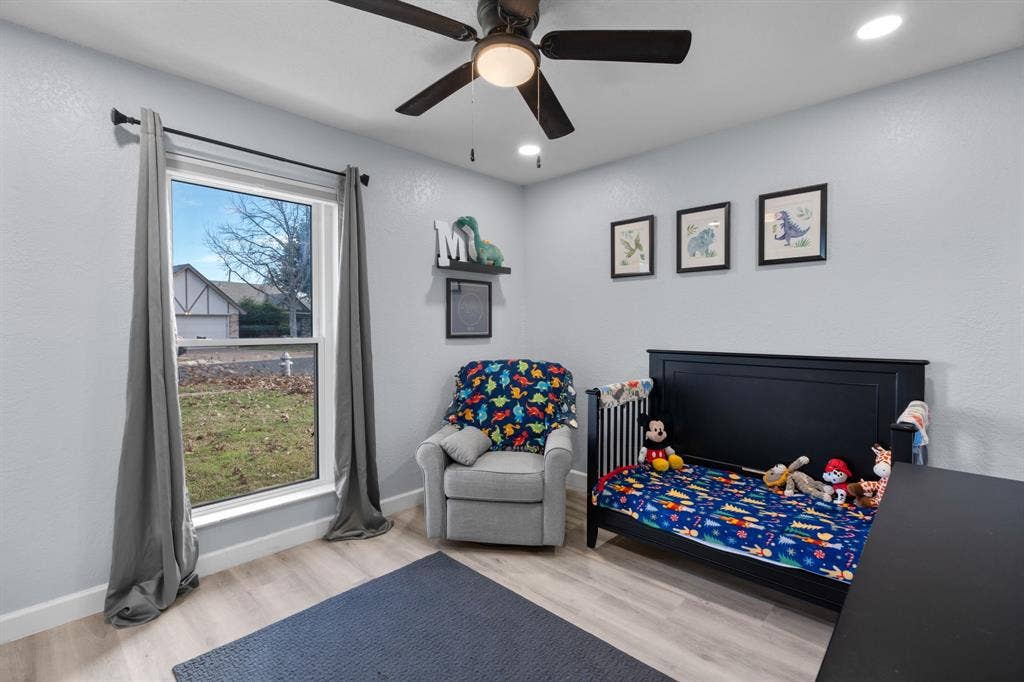 7629 Cedarhill Road, Watauga, TX 76148 Room with light-toned wood-finish flooring, a ceiling fan with integrated lighting, and recessed ceiling lights