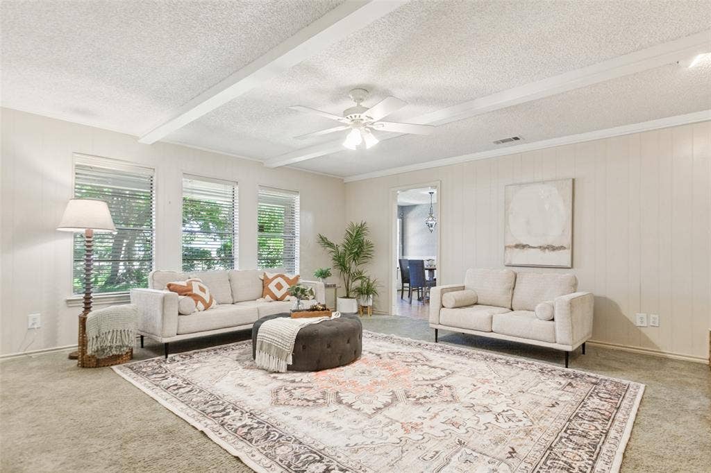 915 Grinnell Drive, Richardson, TX 75081 915 Grinnell Dr. - Spacious den featuring windows overlooking the back porch, a beautiful brick fireplace with built-in storage, and an attached walk-in closet providing exceptional additional storage