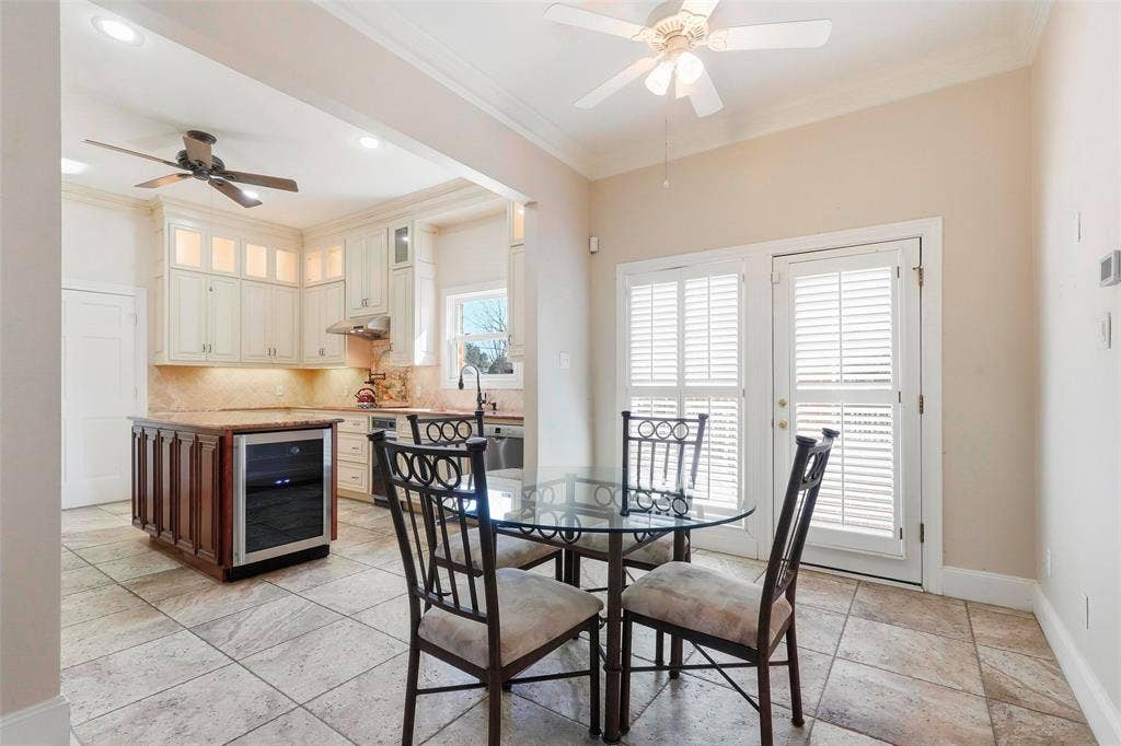 5949 River Bend Drive, Benbrook, TX 76132 Kitchen featuring light-toned cabinetry, a built-in wine refrigerator, and tile flooring