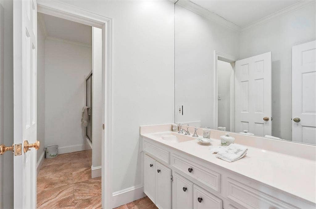 5949 River Bend Drive, Benbrook, TX 76132 Dual vanity with integrated sinks, ample countertop space, and lower cabinetry