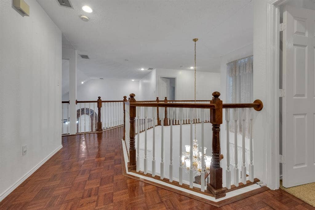 4622 Devonshire Drive, Grand Prairie, TX 75052 Hallway featuring wood-finish parquet flooring, white walls, and recessed lighting
