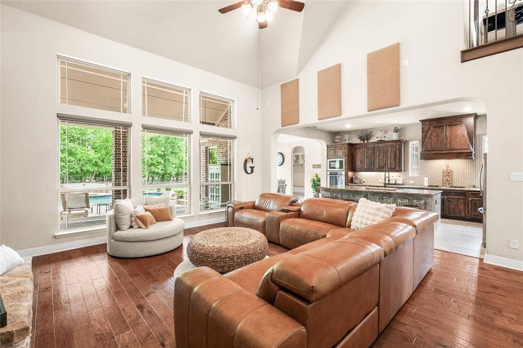 1615 Sara Cove, Lucas, TX 75002 living area looks on to outdoor pool and treed lot