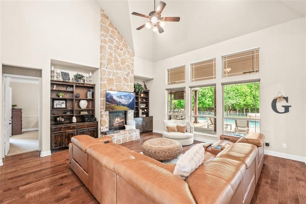1615 Sara Cove, Lucas, TX 75002 family room with built in cabinets, gas fireplace, and high ceilings