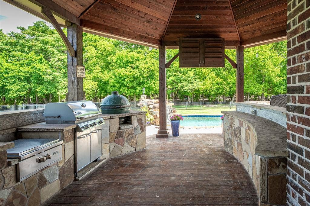 1615 Sara Cove, Lucas, TX 75002 outdoor kitchen with gas grill, green egg and television