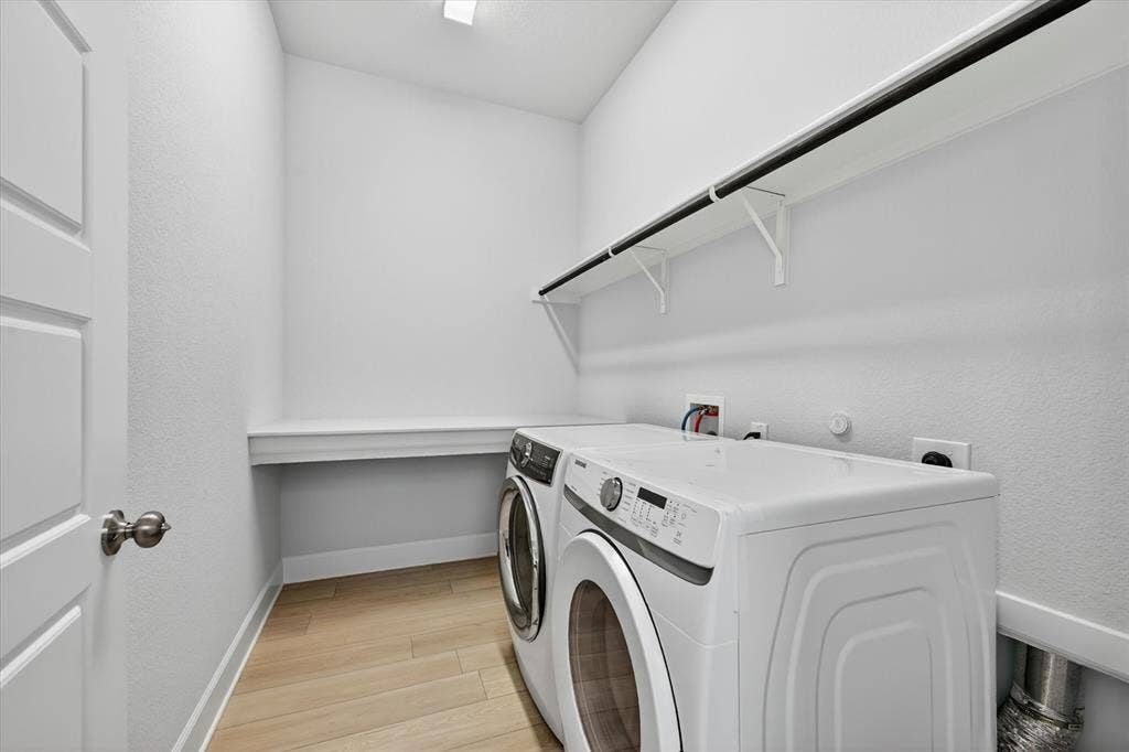 1341 Roundup Way, Argyle, TX 76226 Laundry Room with folding area and Shelf. Washer and Dryer Included!