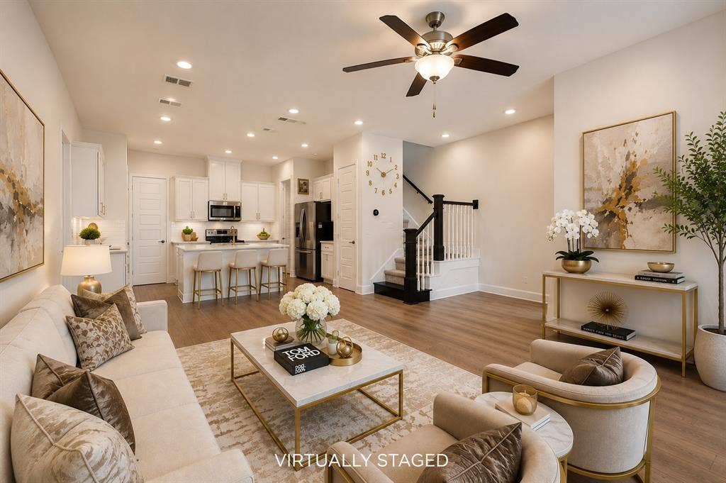 12986 Jk Ojha Street, Farmers Branch, TX 75234 Open-concept living space featuring wood-finish flooring, recessed lighting, and a ceiling fan