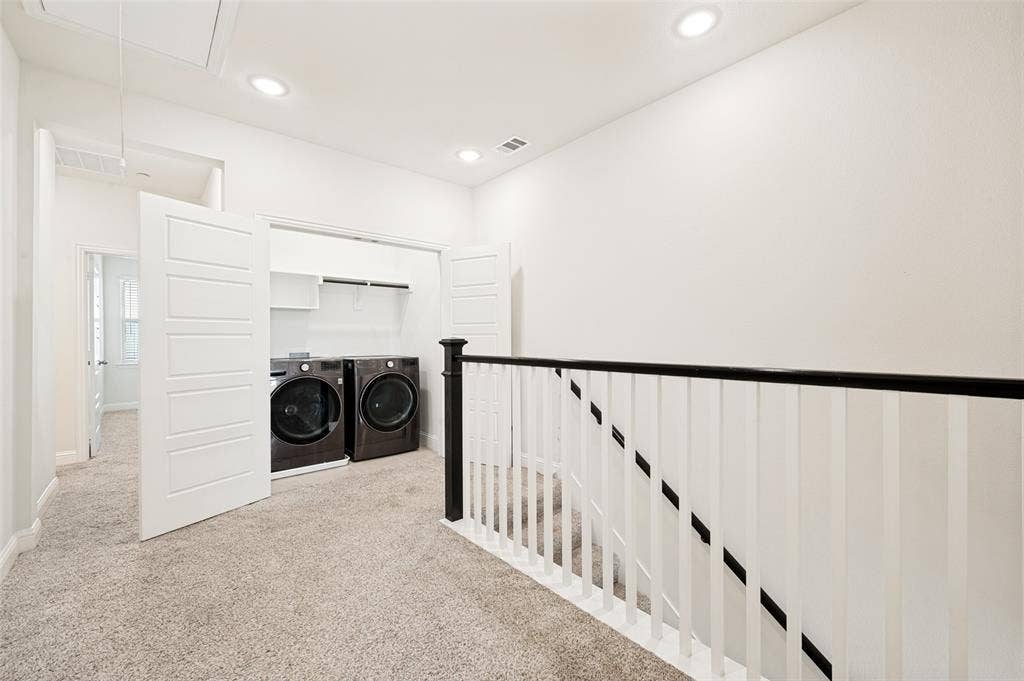 12986 Jk Ojha Street, Farmers Branch, TX 75234 Dedicated laundry closet with front-loading appliances and shelving