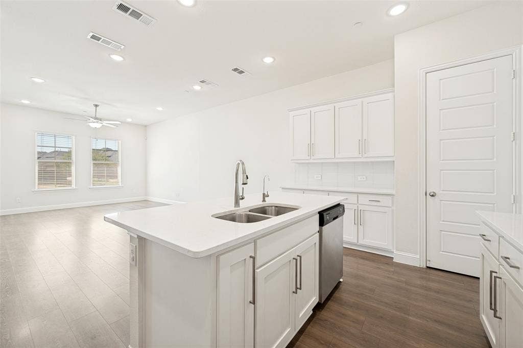 12986 Jk Ojha Street, Farmers Branch, TX 75234 Modern kitchen island with a double basin sink and stainless steel faucet