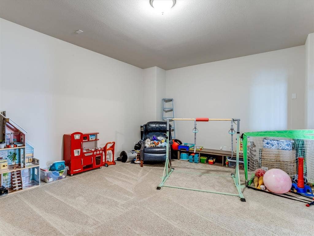 1021 Daylily Drive, Northlake, TX 76226 Carpeted room with neutral wall tones and a ceiling-mounted light fixture