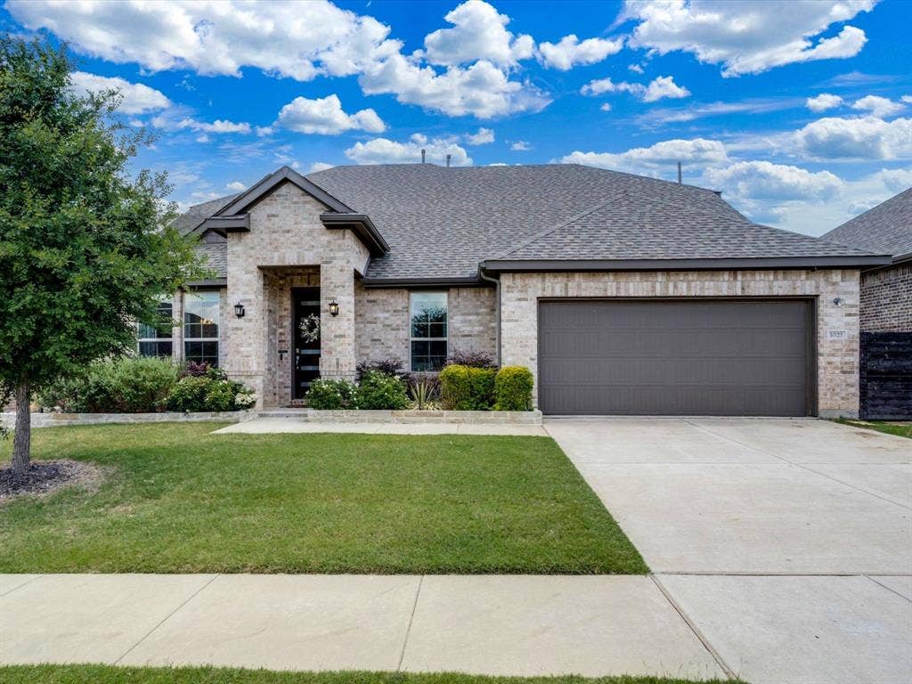 1021 Daylily Drive, Northlake, TX 76226 Brick veneer exterior with a dark gray shingle roof