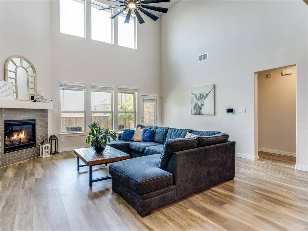 1021 Daylily Drive, Northlake, TX 76226 Vaulted ceilings with an exposed beam fan define this living space