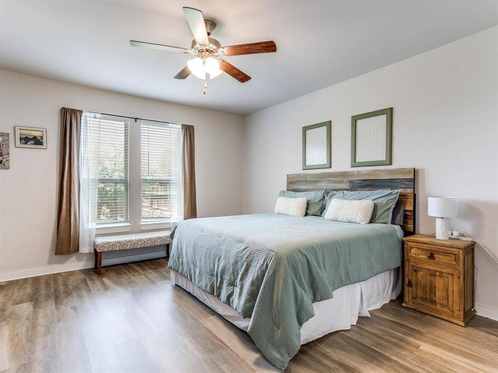 1021 Daylily Drive, Northlake, TX 76226 Bedroom featuring wood-finish flooring, a ceiling fan with integrated lighting, and a large window with blinds