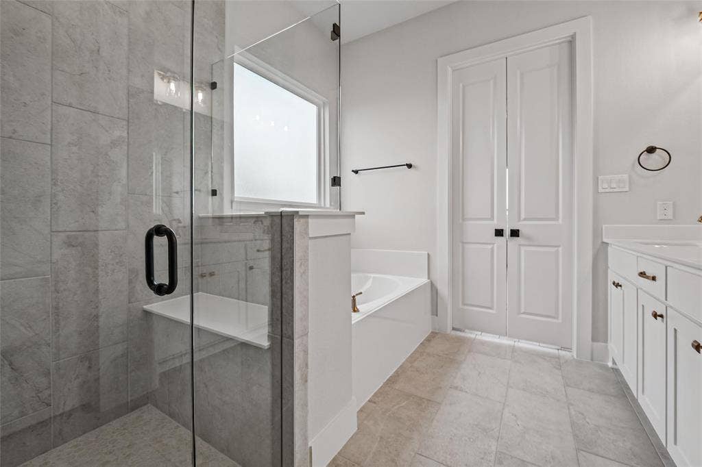 12413 Hornfels Drive, Krum, TX 76249 Walk-in shower with tile surround and built-in bench