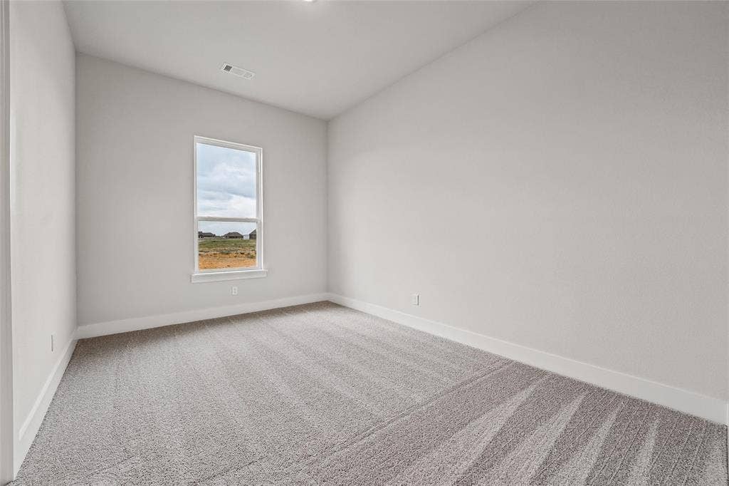 12413 Hornfels Drive, Krum, TX 76249 Vaulted ceiling, gray carpeting, neutral wall paint, recessed lighting, and a single window