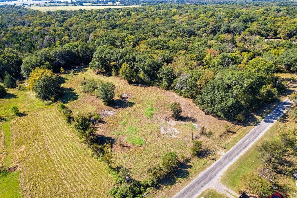 11691 Betty Lane, Kaufman, TX 75142 Expansive land parcel featuring a mix of cleared areas and mature tree coverage