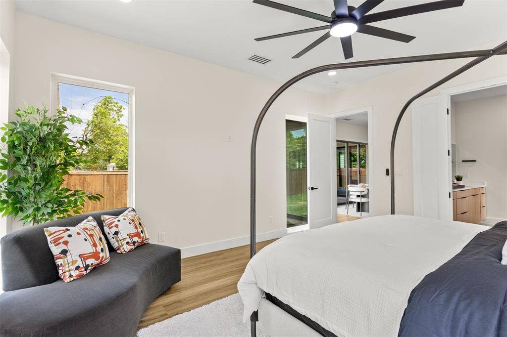 1407 Pueblo Street, Dallas, TX 75212 Bedroom featuring wood-finish flooring, a modern ceiling fan, and white walls