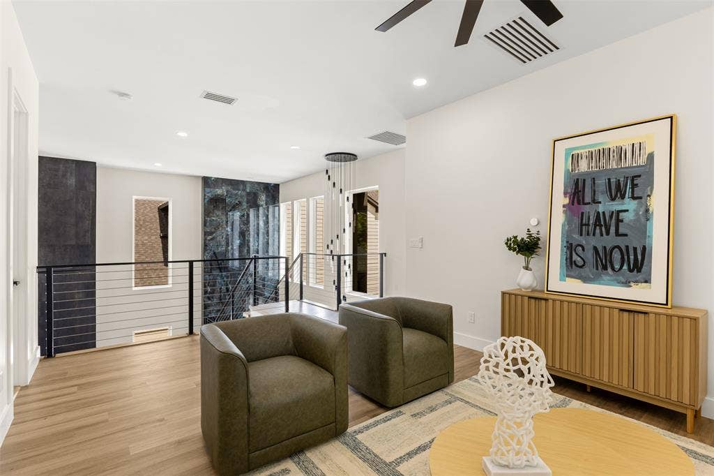 1407 Pueblo Street, Dallas, TX 75212 Loft space featuring wood-finish flooring, vaulted ceilings, and recessed lighting