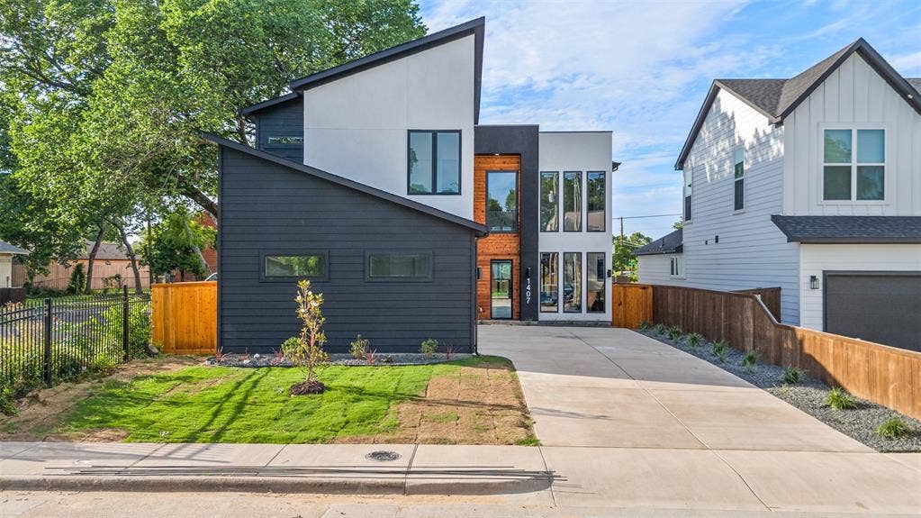 1407 Pueblo Street, Dallas, TX 75212 Modern exterior featuring a striking black and white facade with an angular roofline