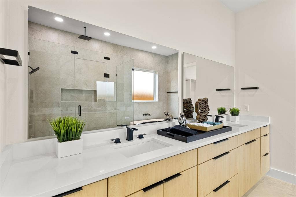 1407 Pueblo Street, Dallas, TX 75212 Bathroom featuring a dual vanity with light-toned cabinetry and white countertops