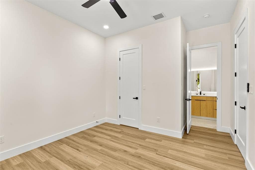 1407 Pueblo Street, Dallas, TX 75212 Spacious room featuring wood-finish flooring, recessed lighting, and a ceiling fan