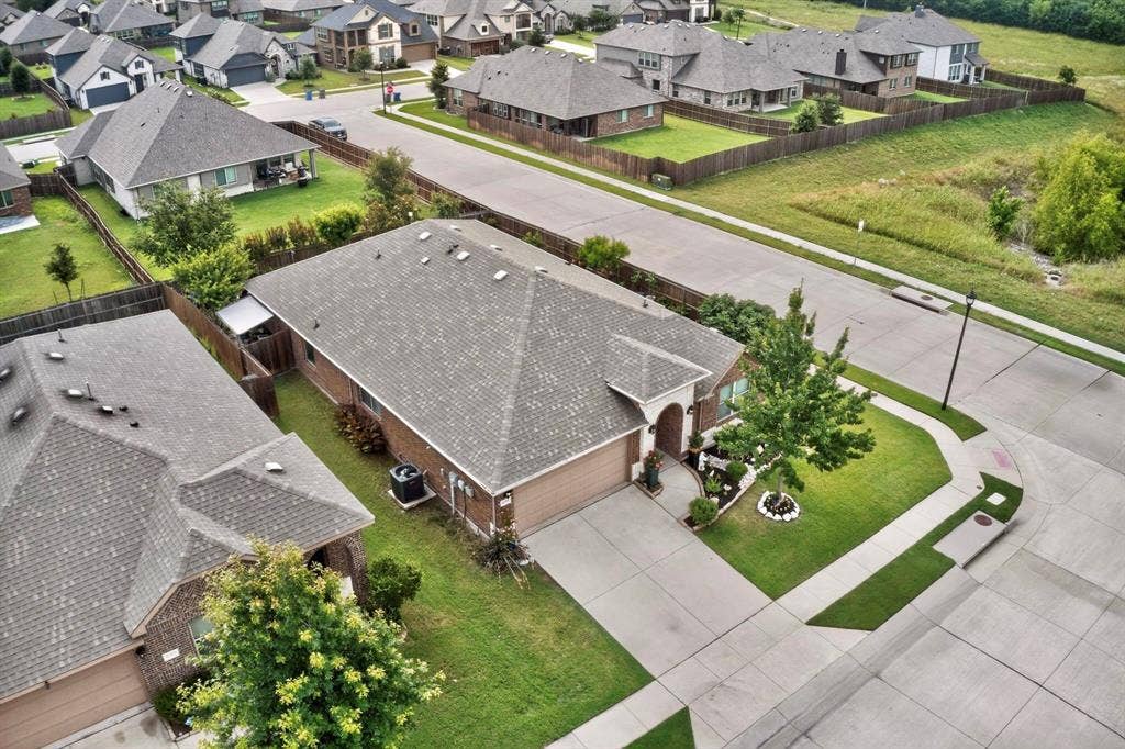 698 Langdon Street, Lavon, TX 75166 Traditional-style home featuring a brick facade, attached two-car garage, and a concrete driveway