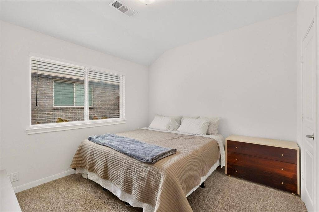 698 Langdon Street, Lavon, TX 75166 Carpeted room featuring white walls, a single window with blinds, and white trim
