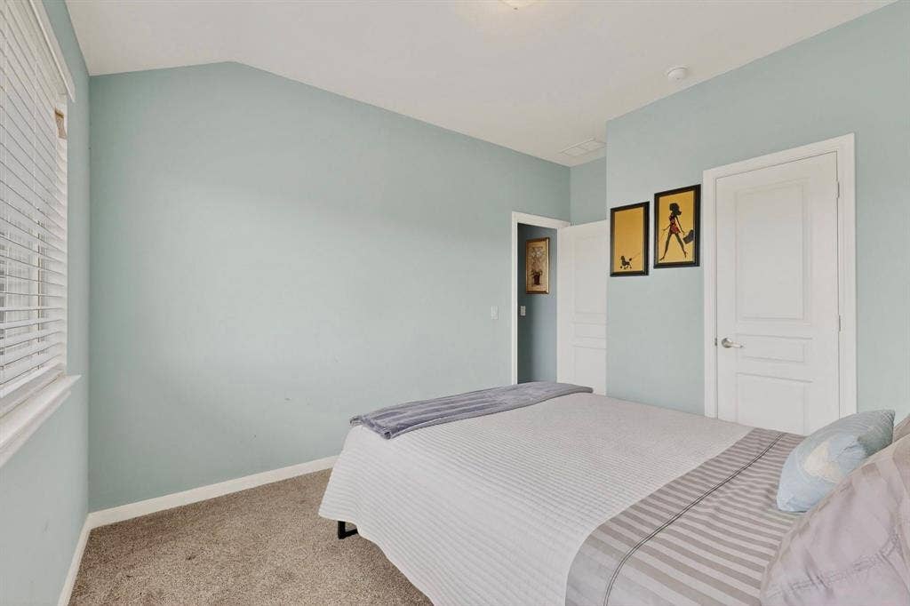 698 Langdon Street, Lavon, TX 75166 Neutral-toned carpeting and light blue walls create a serene atmosphere