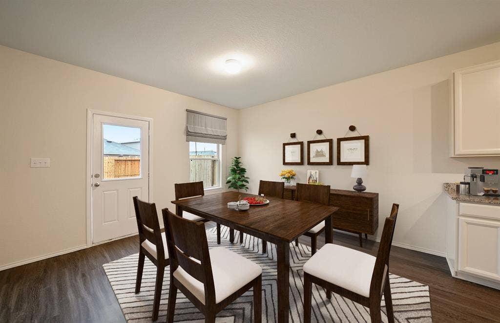 *Model Representation - Dining area off kitchen with large windows