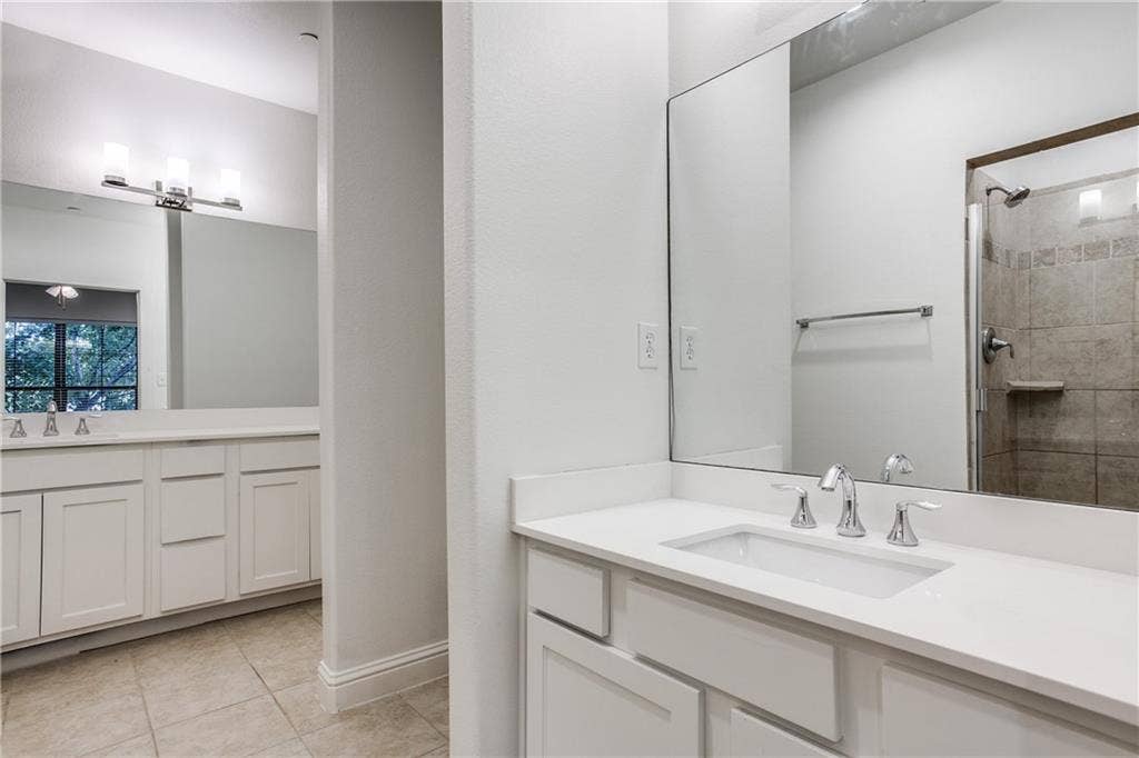 6159 Oram Street, #302, Dallas, TX 75214 Spacious master bath features dual vanities and plenty of cabinet space in the newly updated vanities.