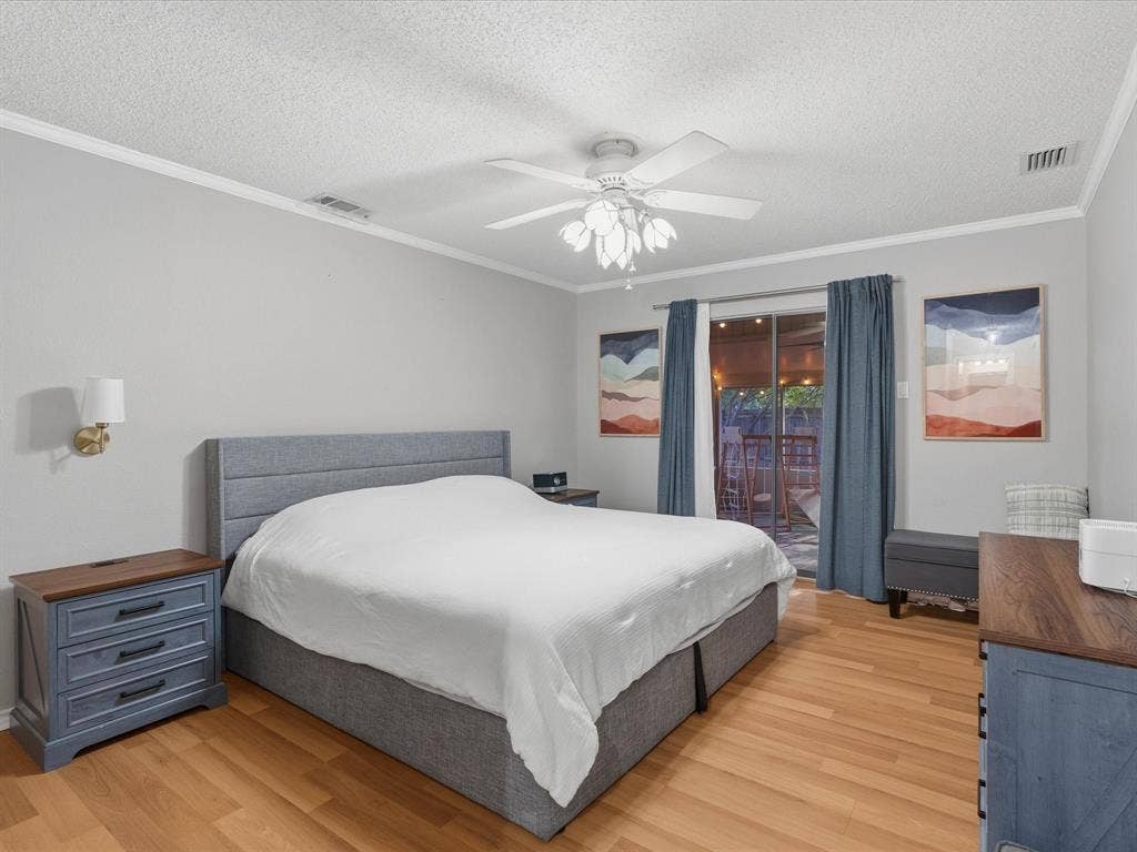 2812 Prescott Drive, Carrollton, TX 75006 Hardwood-style flooring throughout, crowned ceiling, and a ceiling fan with integrated lighting