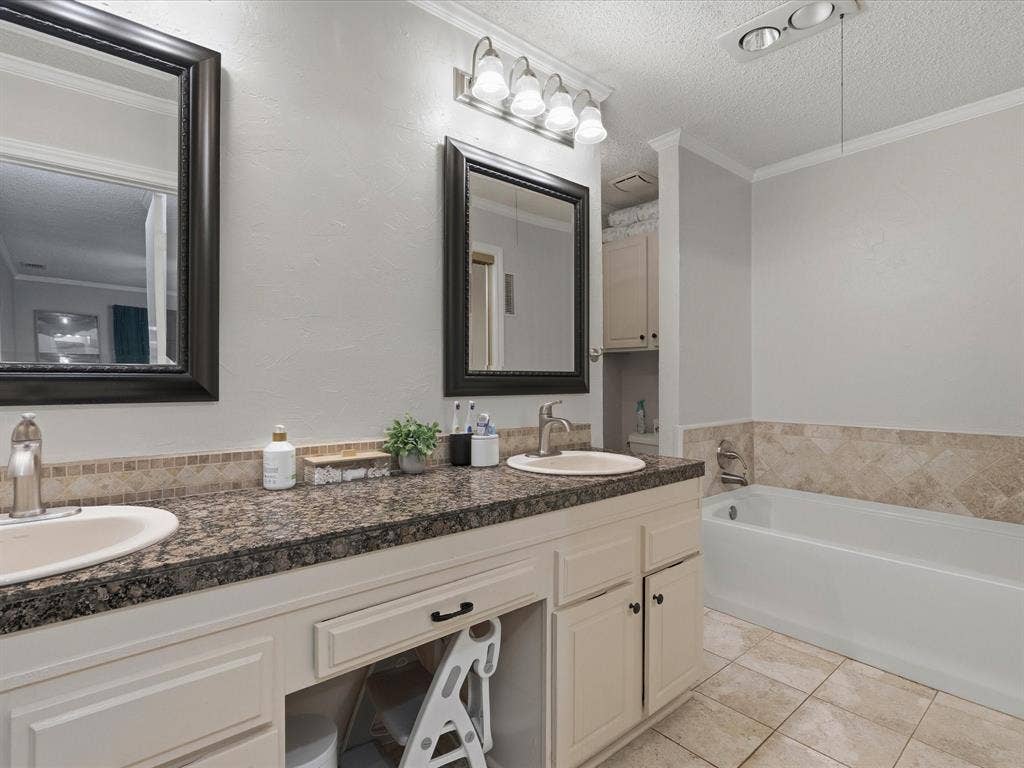 2812 Prescott Drive, Carrollton, TX 75006 Dual vanity featuring granite-look countertops and integrated sinks