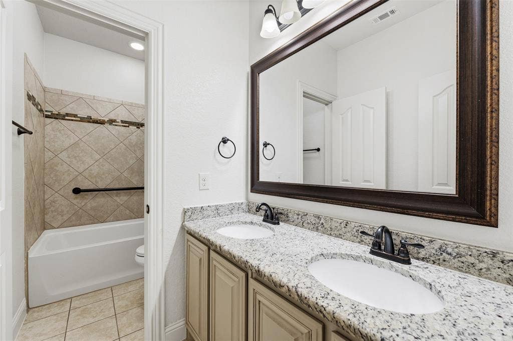 Between 2 secondary bedrooms downstairs