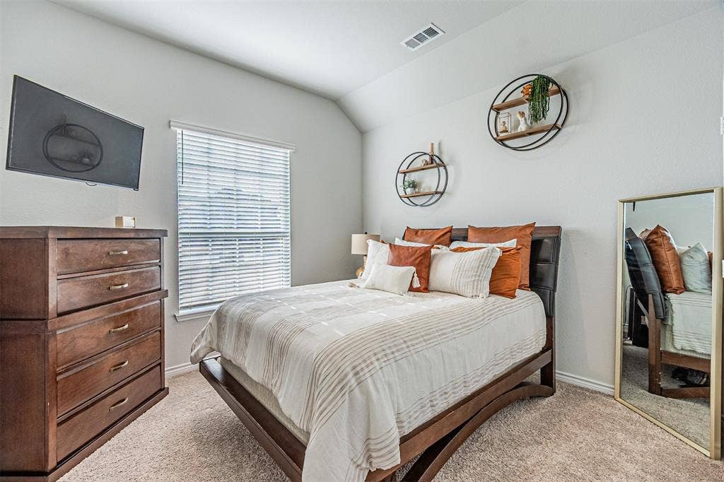 Neutral tone walls with vaulted ceiling