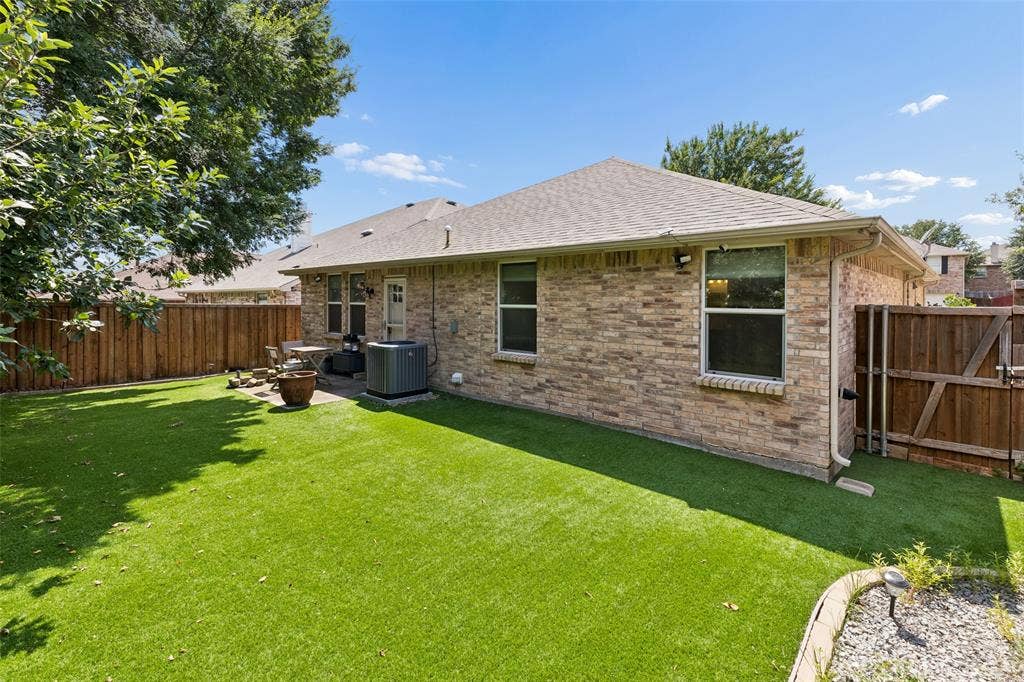 13166 Michelle Drive, Frisco, TX 75035 Spacious, low maintenance backyard with turf installed in 2022.