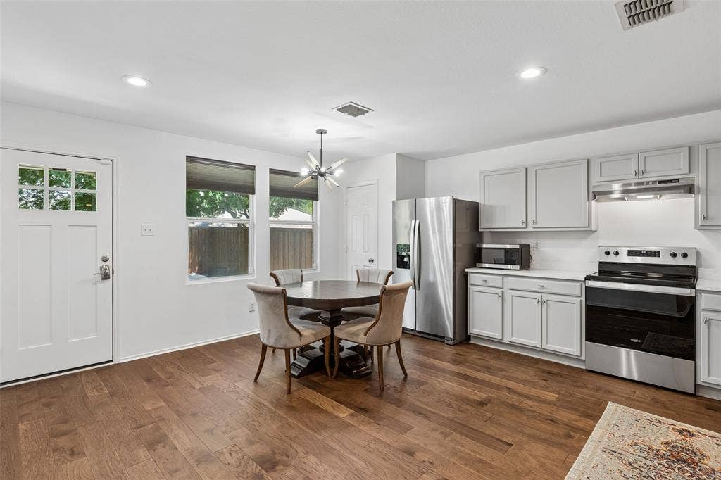 13166 Michelle Drive, Frisco, TX 75035 Kitchen updated with quartz countertops, fresh paint and new hardware.