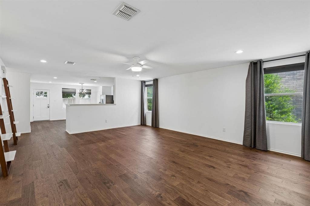 13166 Michelle Drive, Frisco, TX 75035 Open floor plan with wood flooring throughout.