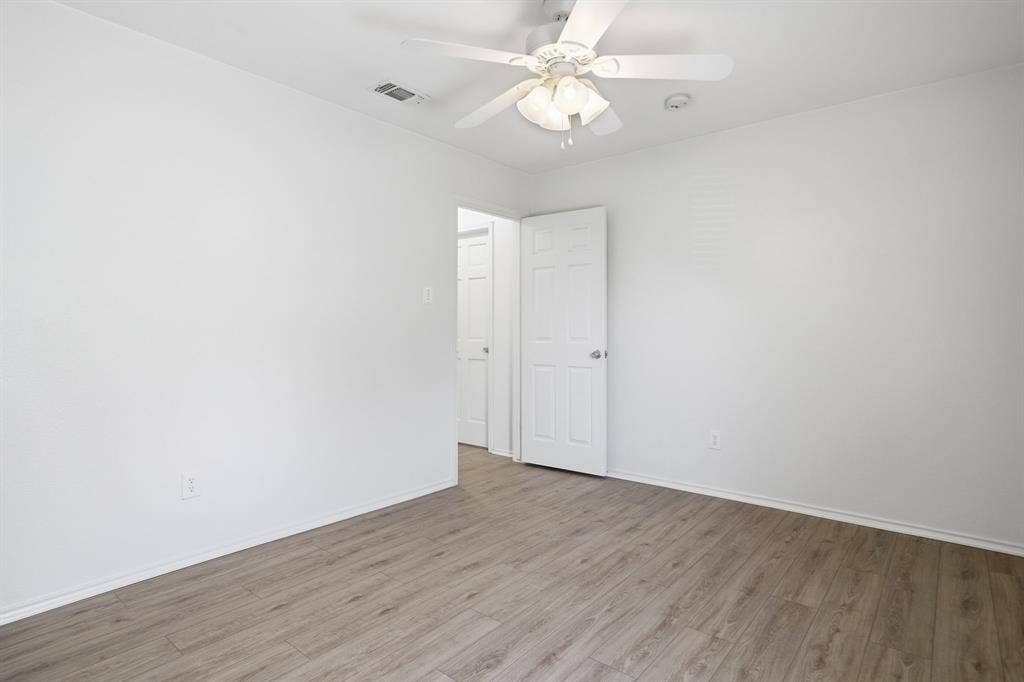 Neutral wall palette with wood-finish flooring