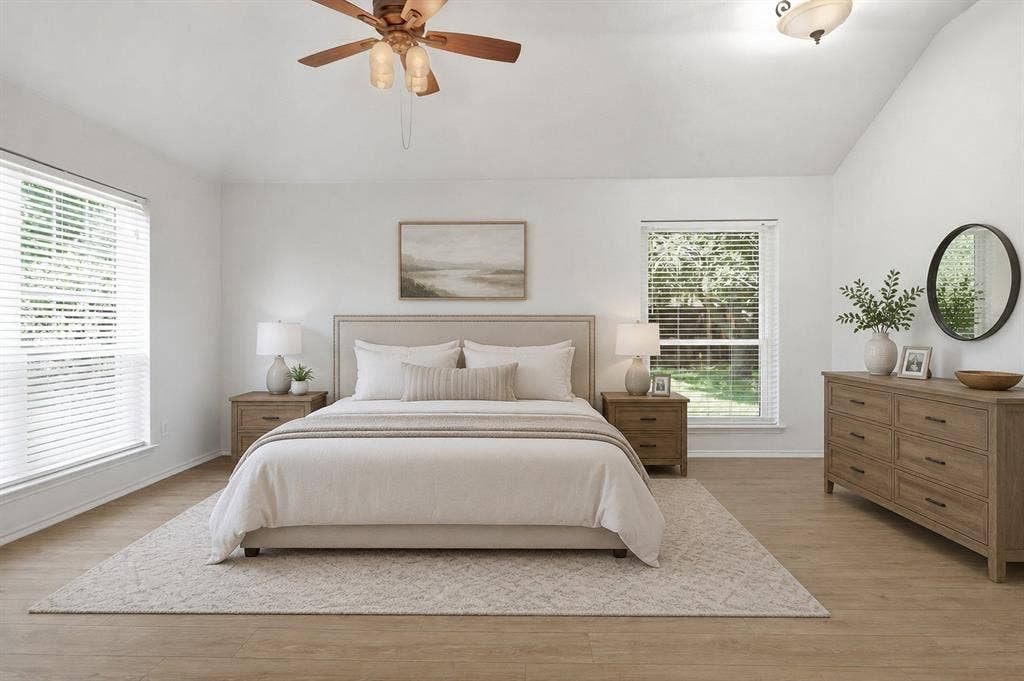 Vaulted ceiling with a ceiling fan and flush-mount light fixture. Photo virtually staged using AI.