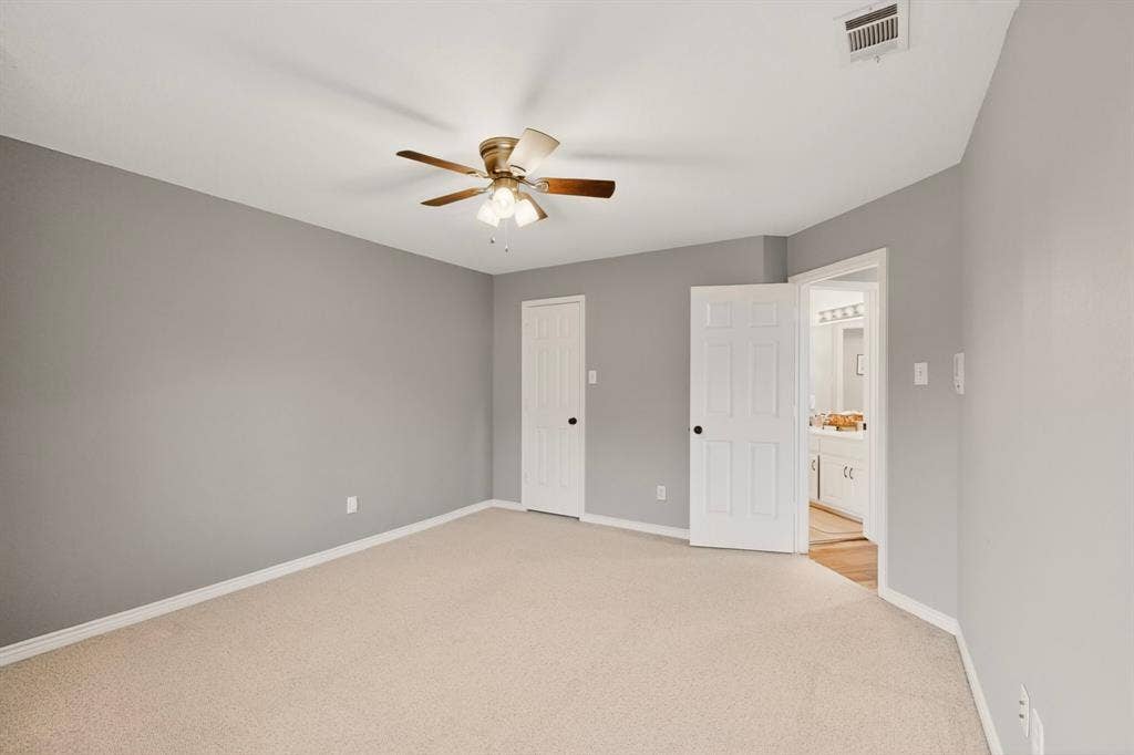 712 Water Oak Drive, Plano, TX 75025 Carpeted room with light gray walls and white trim