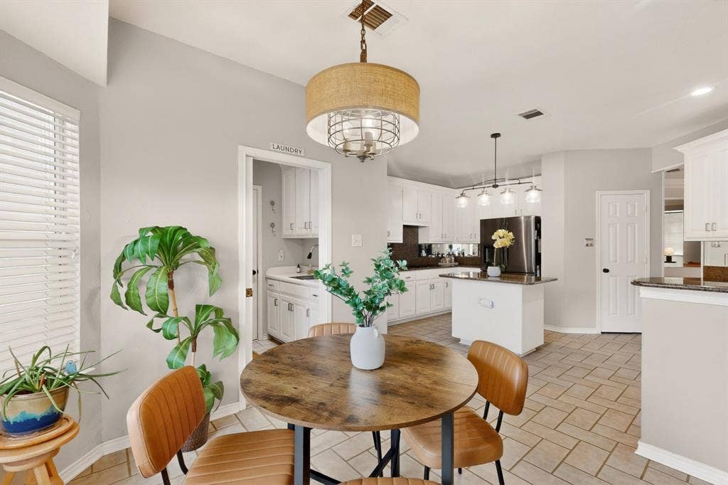 712 Water Oak Drive, Plano, TX 75025 Open concept kitchen and dining area featuring ceramic tile flooring