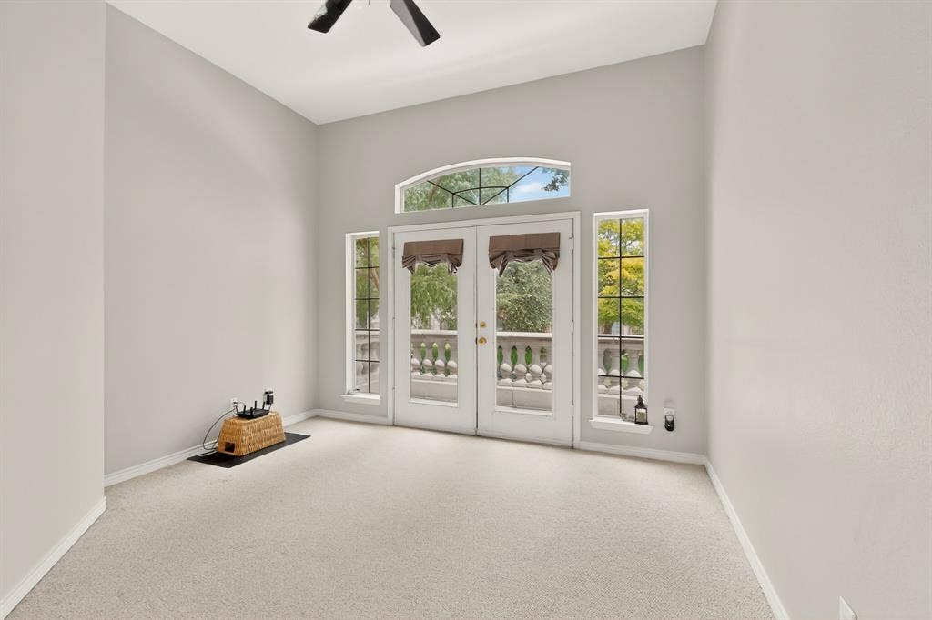 712 Water Oak Drive, Plano, TX 75025 Double glass doors with an arched transom window and sidelights