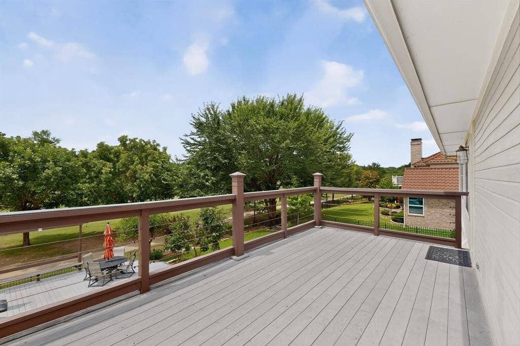 712 Water Oak Drive, Plano, TX 75025 Expansive outdoor deck featuring wood-finish flooring and a cable railing system