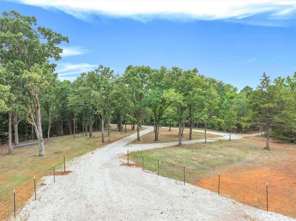 16092 County Road 440, Lindale, TX 75771 White rock road system through property. Underground electric, co-op water meter. Trails cut throughout property, and two new lakes.