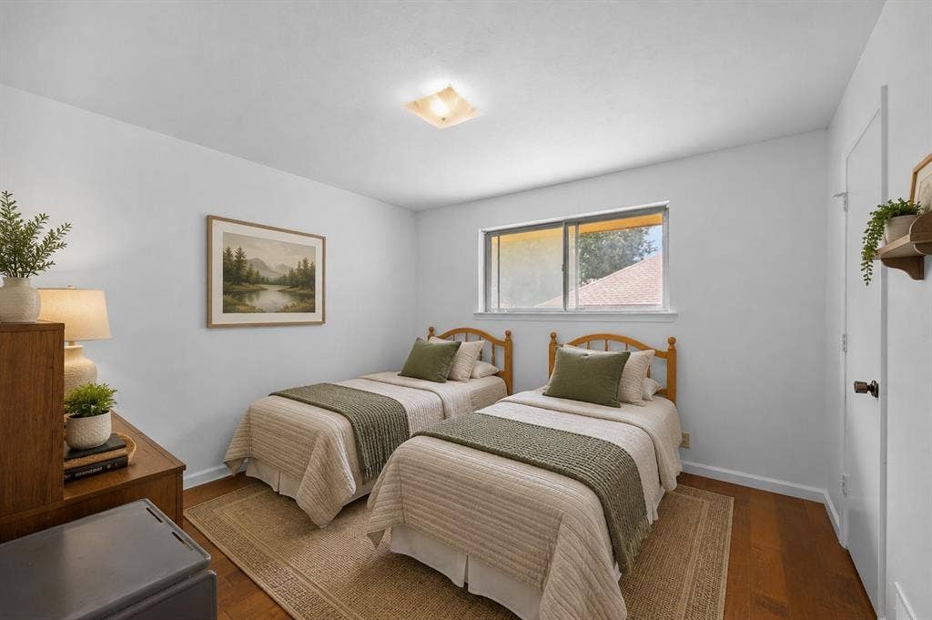 2125 Woodbrook Street, Denton, TX 76205 Room featuring wood-finish flooring, a neutral wall color, and a flush-mount ceiling light fixture