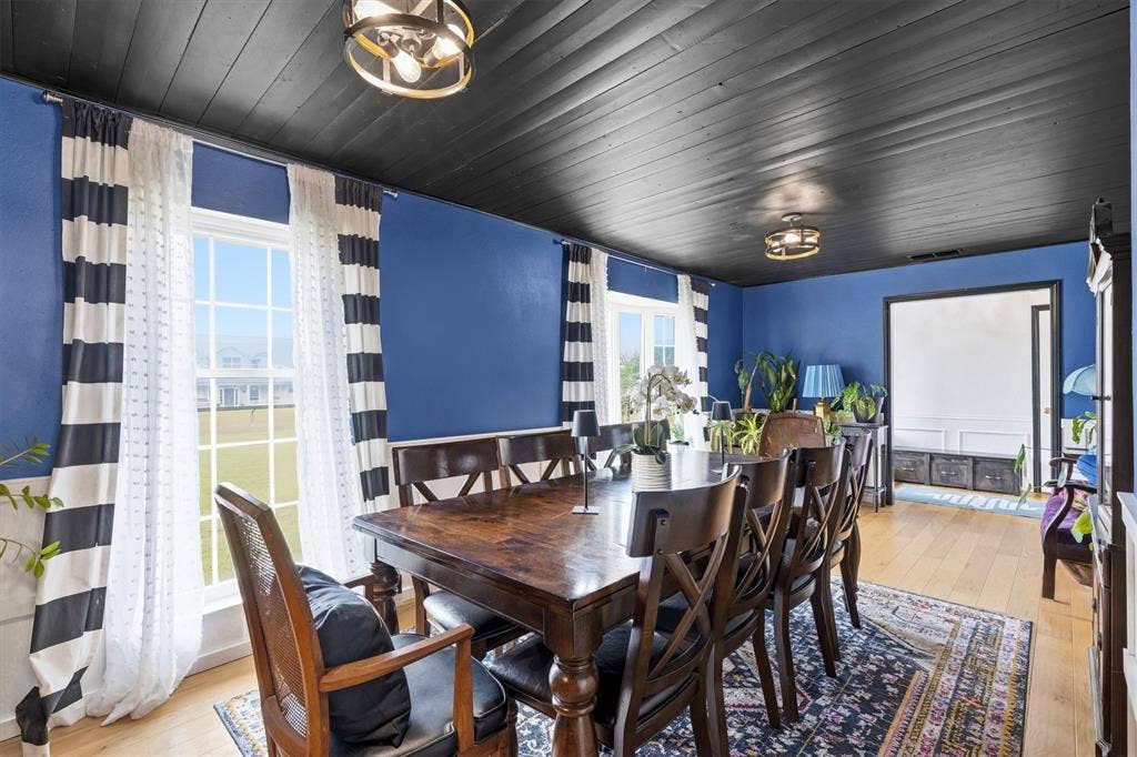 216 Meadowlark Lane, Wylie, TX 75098 Dining Area with Decorative wood ceiling and decorative lighting.