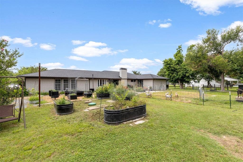 216 Meadowlark Lane, Wylie, TX 75098 Back yard currently with goats and ducks.