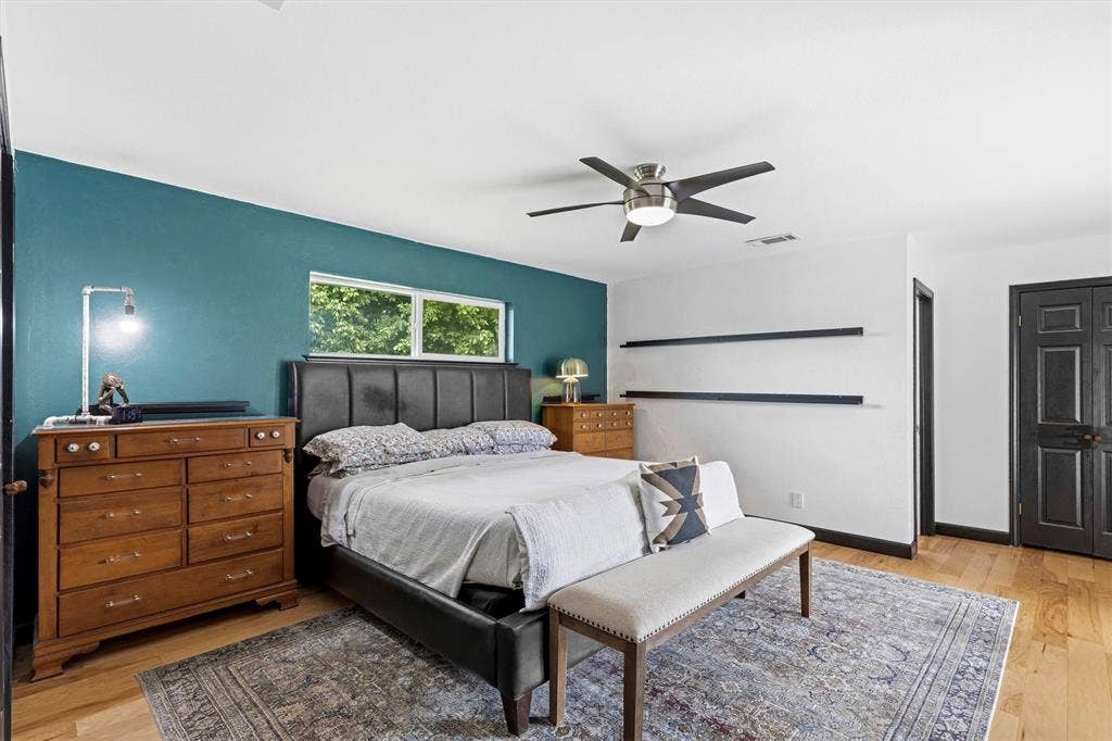 216 Meadowlark Lane, Wylie, TX 75098 Primary Bedroom with Wood floors and two closets.