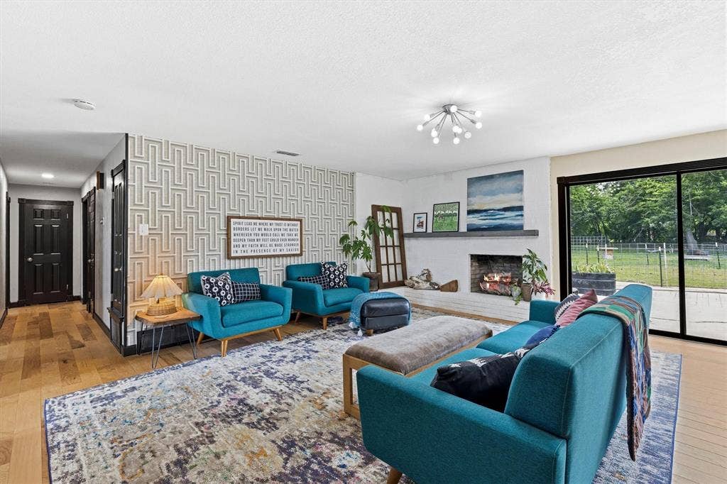 216 Meadowlark Lane, Wylie, TX 75098 Living Room with Wood Burning Fireplace.