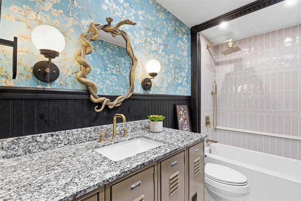 216 Meadowlark Lane, Wylie, TX 75098 Updated Secondary Bath with Tub Shower Combination and one of a kind custom locker vanity.
